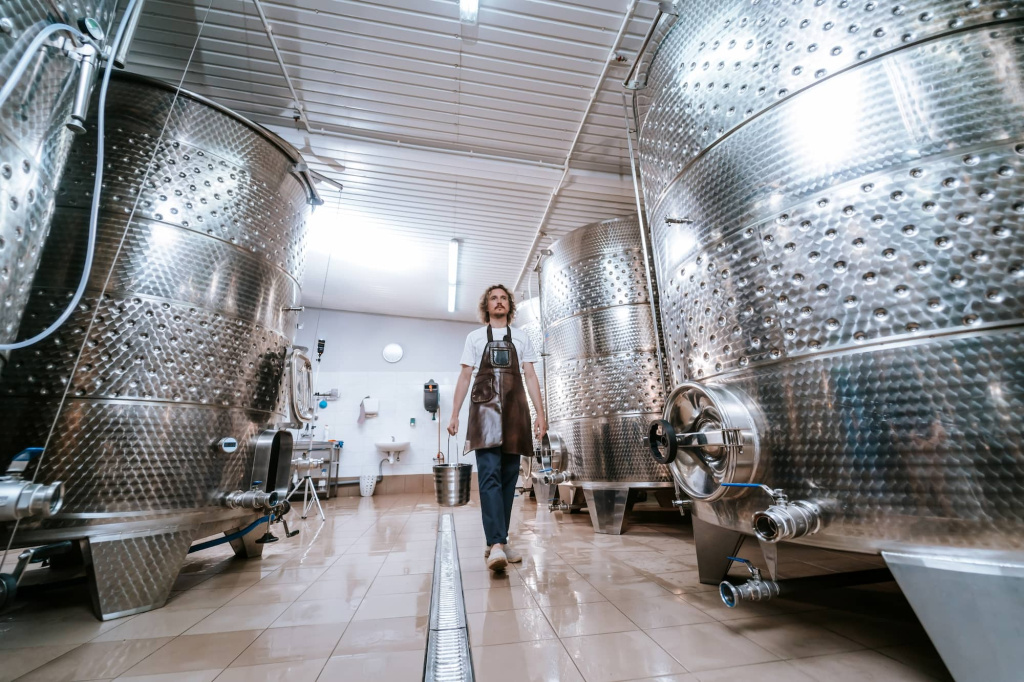 winemaker-carrying-bucket-in-winery-fermentation-r-2024-12-07-12-16-43-utc (1).jpg